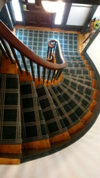 Carpet on winding stairs.